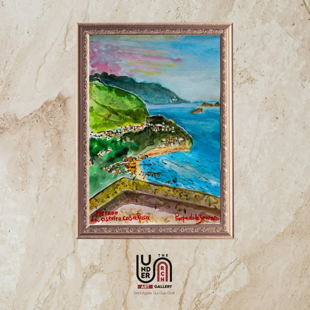A colorful framed painting of the bay of Nerano on the Amalfi Coast, showing the crystal blue sea, the beach, and the green hills from a panoramic balcony.